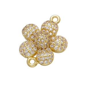Macro detail of gold flower connector with micro-pave cubic zirconia for DIY jewelry