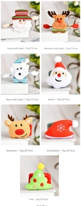 Detail view of plush Christmas slap bracelets with Santa, reindeer, and LED light features