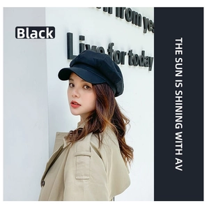 Classic black octagonal newsboy hat in breathable cotton linen shown on a fashion model