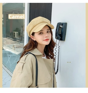 Detailed view of camel octagonal newsboy hat with refined stitching and retro style