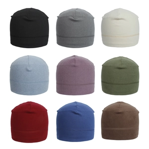 Selection of nine colorful knitted beanie hats for outdoor sports and warmth