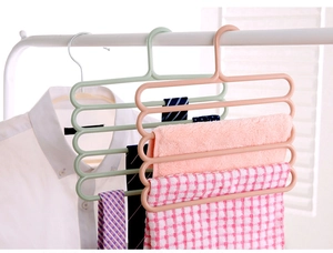 Detail view of 5-tier plastic pants hanger for organizing scarves and ties in wardrobe