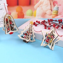Detail of wooden Christmas ornaments featuring Santa and reindeer with red hanging cords