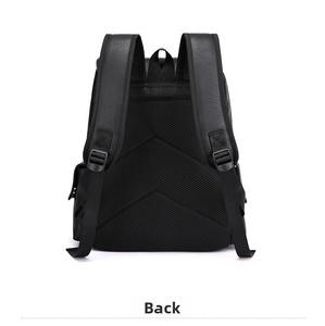 Detail view of breathable honeycomb mesh back panel and padded straps on black PU backpack