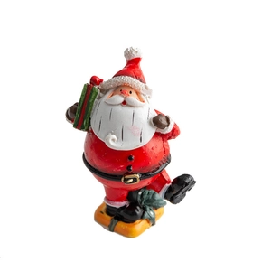 Christmas Santa Claus resin figurine holding a green gift box on a white background
