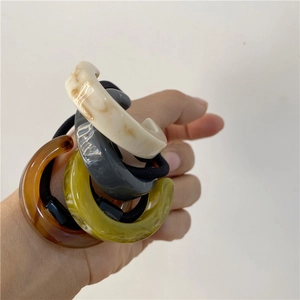 Detail of colorful acetate resin hair ties with marble pattern and elastic band