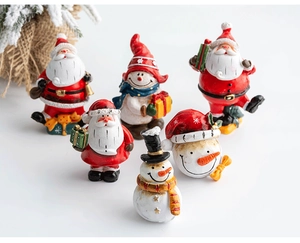 Detailed collection of festive resin Santa and snowman figurines for Christmas tabletop decor