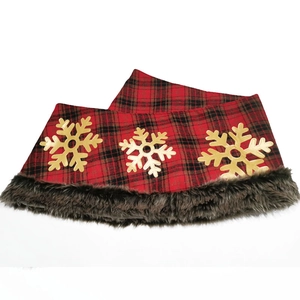 Plaid Christmas tree skirt with golden snowflakes and brown faux fur trim on white background