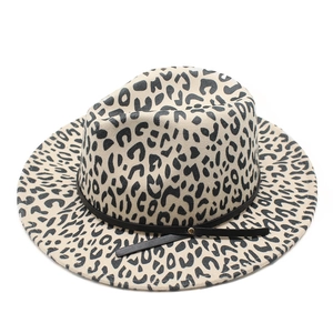 Detail of leopard print jazz hat with black leather strap and wide flat brim