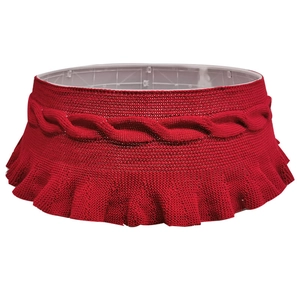 Classic red knitted Christmas tree skirt with cable stitch patterns and ruffle edges