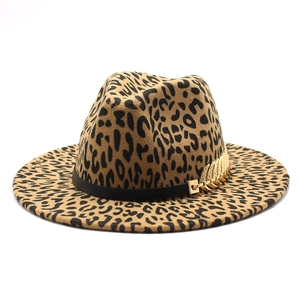 Leopard print felt fedora hat with a black band and gold leaf metal detail on white background