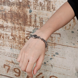 Men's retro punk skull bracelet in vintage titanium steel worn on wrist