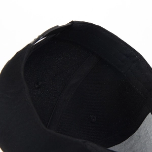 Detail view of the black cotton twill baseball cap interior with adjustable strap