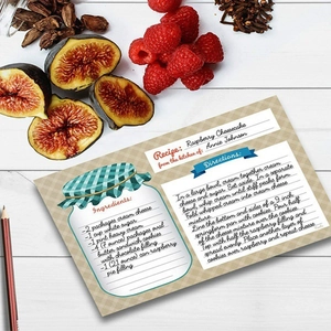 Raspberry Cheesecake Recipe Card on white wooden background with fresh berries