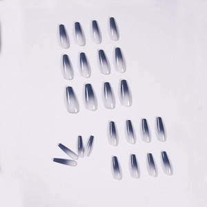 Long coffin press-on nails with navy blue to white ombre gradient and glossy finish