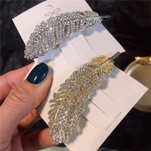 Sparkling feather-shaped crystal hair pins in silver and gold set for women's hairstyle
