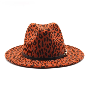 Detail of orange leopard print wool fedora with black leather band and gold buckle