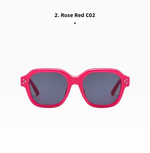 Close-up of rose red square sunglasses featuring decorative triple silver rivets on the frame