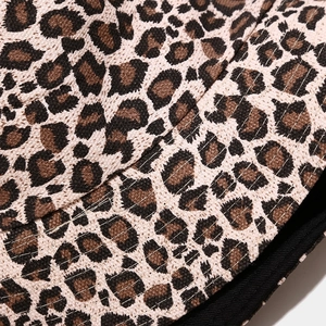 Close-up of leopard print canvas bucket hat showing reinforced stitching and twill texture