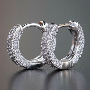 Sparkling S925 silver hoop earrings with micro-paved white zircons on dark background