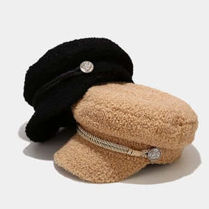 Plush sherpa fleece newsboy caps in black and camel with decorative rope and metal buttons