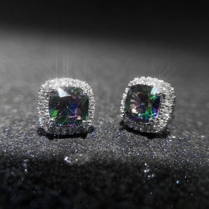 Macro detail of square mystic topaz earrings with double halo cubic zirconia setting