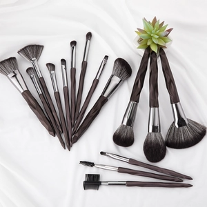15-piece professional diamond makeup brush set with dark brown gradient bristles on white fabric