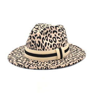 Detail of leopard print wool fedora with striped ribbon band and buckle accent