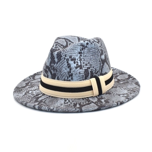 Detail of grey snake print wool felt fedora hat with a striped ribbon decorative band