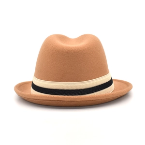 Classic camel wool fedora hat with black and white striped ribbon band on white background