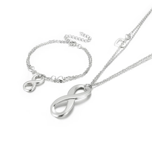 Silver infinity symbol necklace and bracelet set with delicate heart charms for women