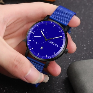 Detail of blue Milanese mesh strap and dark dial on a men's business quartz watch