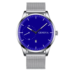 Detail view of quartz watch with blue dial, silver mesh strap, and calendar display