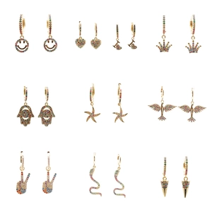 Set of 10 gold earrings with colorful zircon charms including heart, snake and hamsa styles