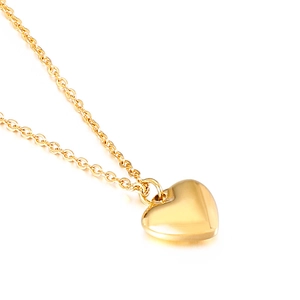 Minimalist gold heart pendant necklace with cross chain on a clean white background