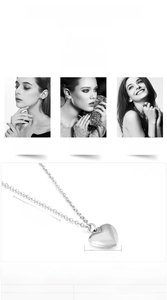 Macro detail of stainless steel heart pendant necklace with dimensions and chain texture