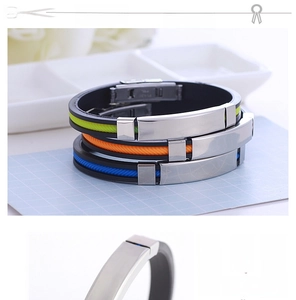 Detail showing silicone wristband with stainless steel plate and colorful side stripes