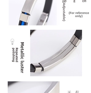 Macro detail of adjustable stainless steel silicone bracelet showing polished buckle finish