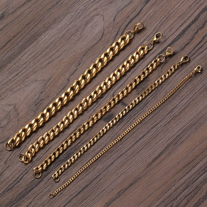Detail showing five different widths of golden Cuban link chains with lobster clasps