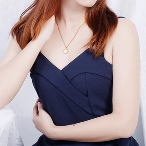 Gold stainless steel Elizabeth coin pendant necklace worn on neck for a vintage look