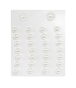 Macro detail of white faux pearl face gems for DIY makeup and forehead decoration