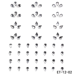 Macro view of teardrop acrylic face rhinestones with self-adhesive backing in flower shapes