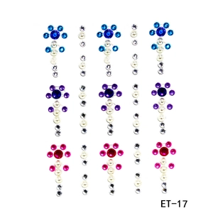Detail view of colorful acrylic rhinestone face stickers in floral patterns model ET-17