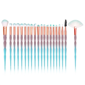 Detail of 19 makeup brushes with diamond-cut gradient handles and dual-tone bristles