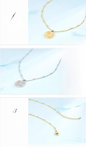 Detail of medical titanium steel coin pendant with lobster clasp and adjustable tail chain