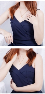 Detail of vintage gold-plated Elizabeth portrait coin pendant necklace on model