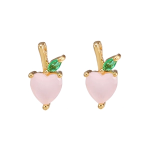 Detail view of gold-plated peach earrings with pink heart and green zircon stones