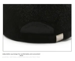 Detail of adjustable metal buckle and plush black fabric on the winter baseball cap