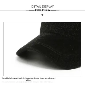 Macro detail of thick wool texture and reinforced brim of a black winter baseball cap