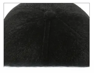 Macro view of meticulous stitching on the crown of a black plush winter hat